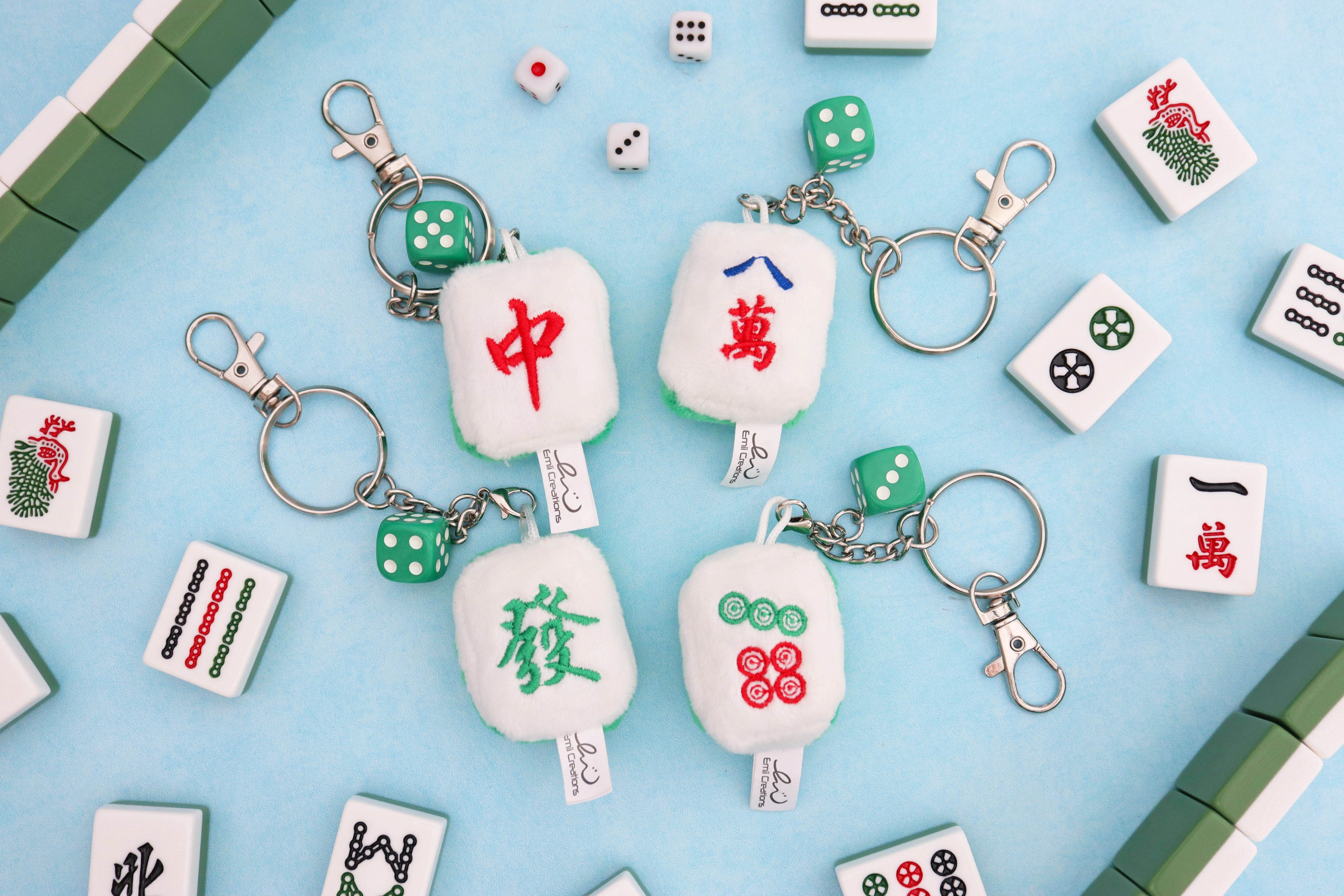 Four mahjong plush tile keychains